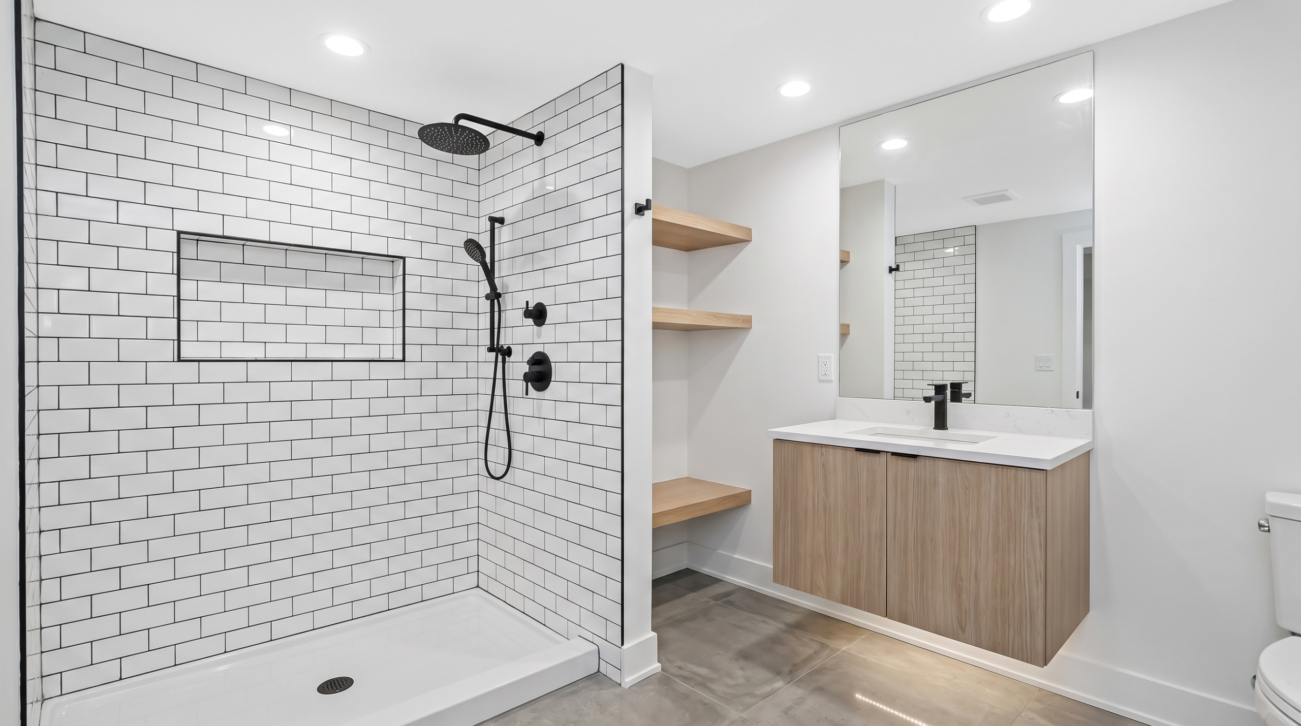 Adding a Basement Bathroom in Chicago: Plumbing, Permits & Cost Factors 1 Modern finished basement bathroom with tiled walk-in shower, compact vanity and bright lighting